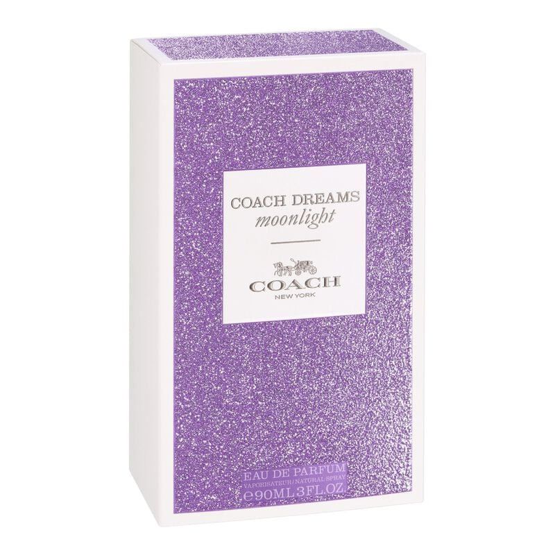 Eine rechteckige Verpackung mit lila Glitzer. Auf der Vorderseite steht "COACH DREAMS moonlight" und das Logo.