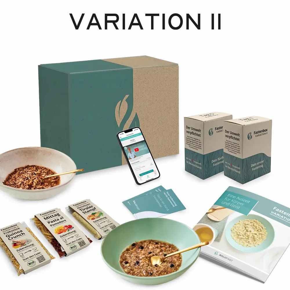 Salufast 5-Tage Fastenbox, Variation II, mit Box, Mahlzeiten, App und Broschüre. Zwei Schalen mit Speisen und goldene Löffel.