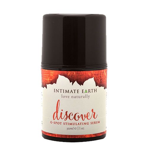 Zylinderförmige Flasche. Aufschrift: Intimate Earth, Discover, G-Spot Stimulating Serum. Brauner Deckel und Etikett mit rotem Muster.