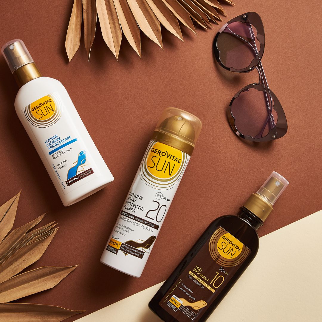 Drei Gerovital Sun Produkte: Bräunungsöl, Sonnencreme SPF 20, beruhigende Sonnenlotion. Sonnenbrille und Blätter im Hintergrund.