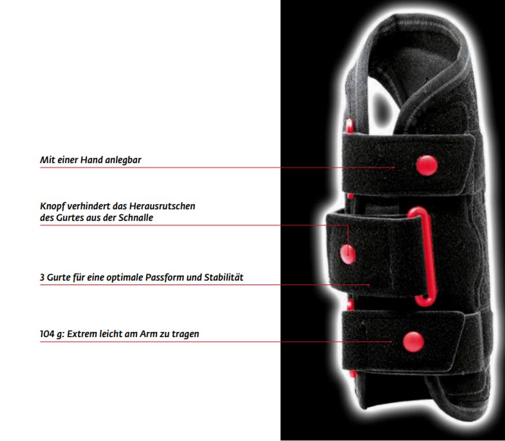 Schwarze Handgelenkorthese mit roten Verschlüssen. Text: 3 Gurte, Knopf, 104g. Marke DONJOY® nicht sichtbar.