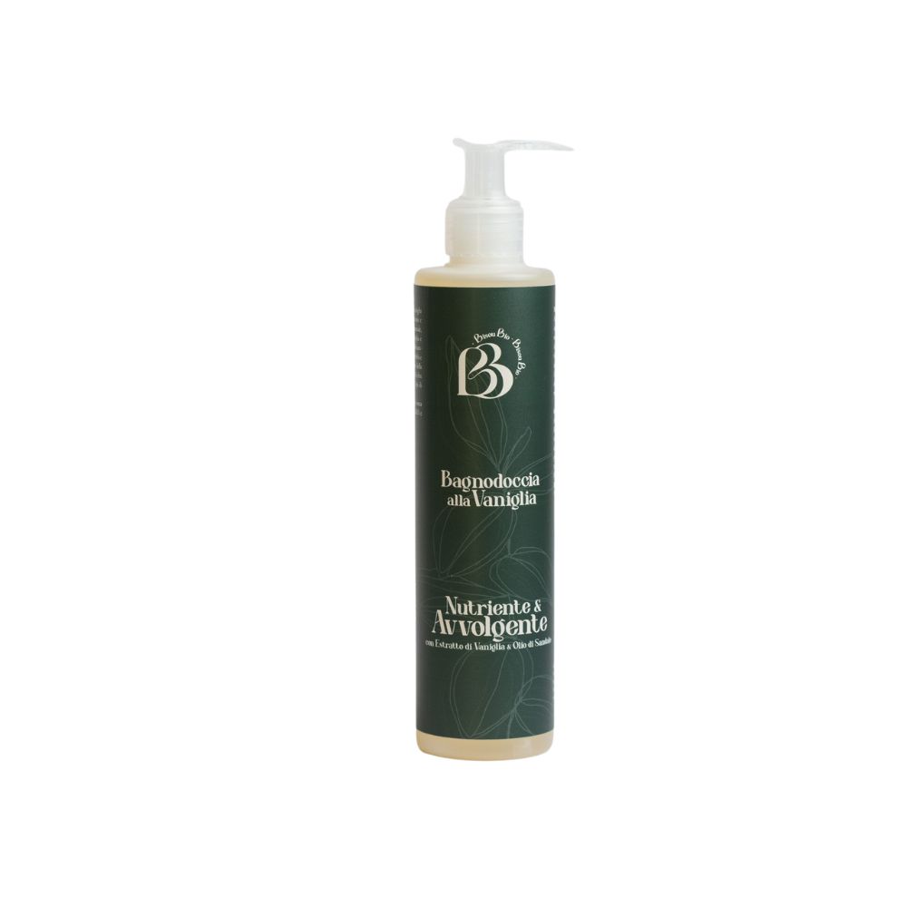 Flacone cilindrico con dosatore. Scritta: Bagnodoccia alla Vaniglia, Nutriente & Avvolgente. Sfondo verde scuro con motivi fogliari.