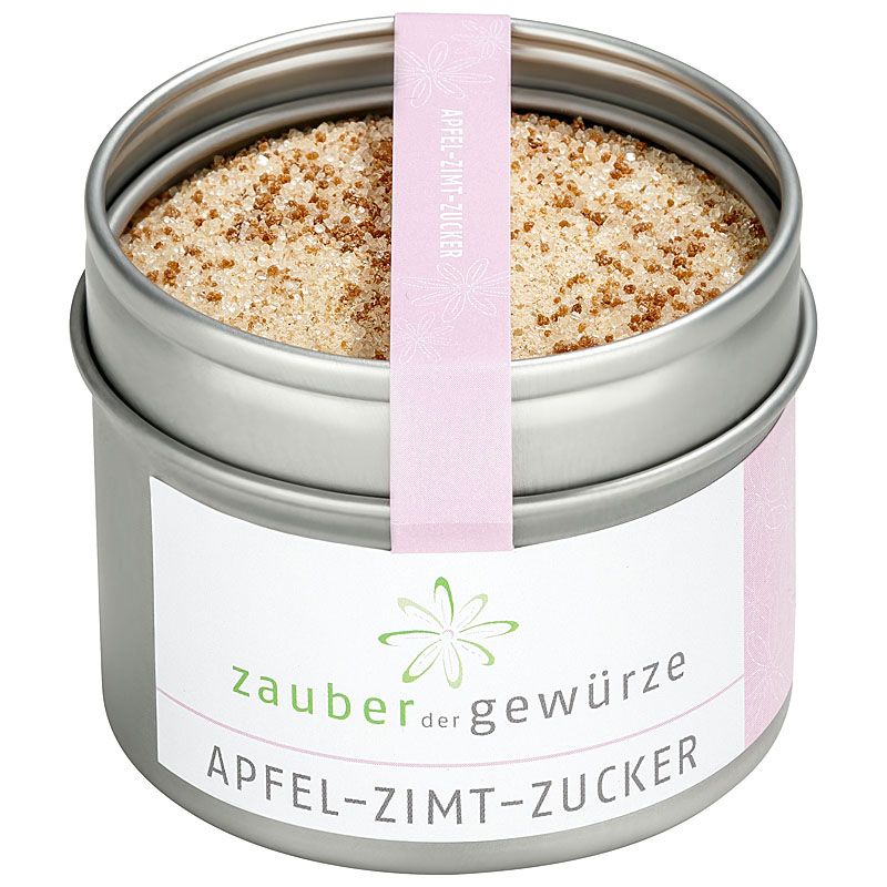 Runde Dose mit Apfel-Zimt-Zucker. Rosa Etikett mit Produktnamen und Logo. Deckel mit rosa Band. Inhalt sichtbar.