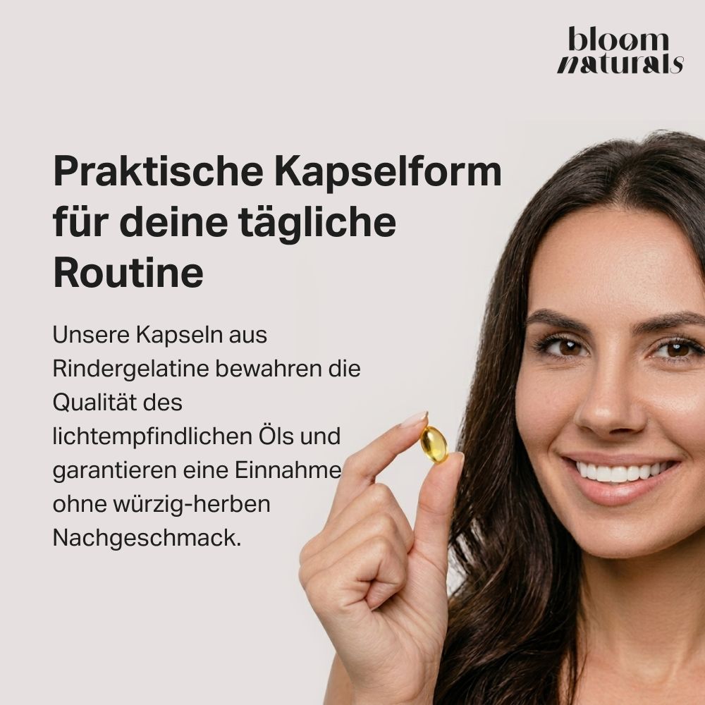 Frau hält eine Softgel Kapsel Schwarzkümmelöl. Kapseln aus Rindergelatine für tägliche Routine.