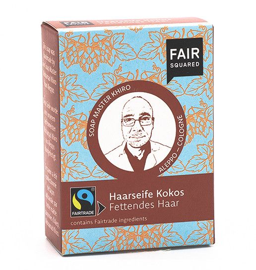 Kartonverpackung mit FAIR SQUARED Logo und Produktbezeichnung. Enthält Fairtrade-Inhaltsstoffe. Bild von Soap Master Khiro.