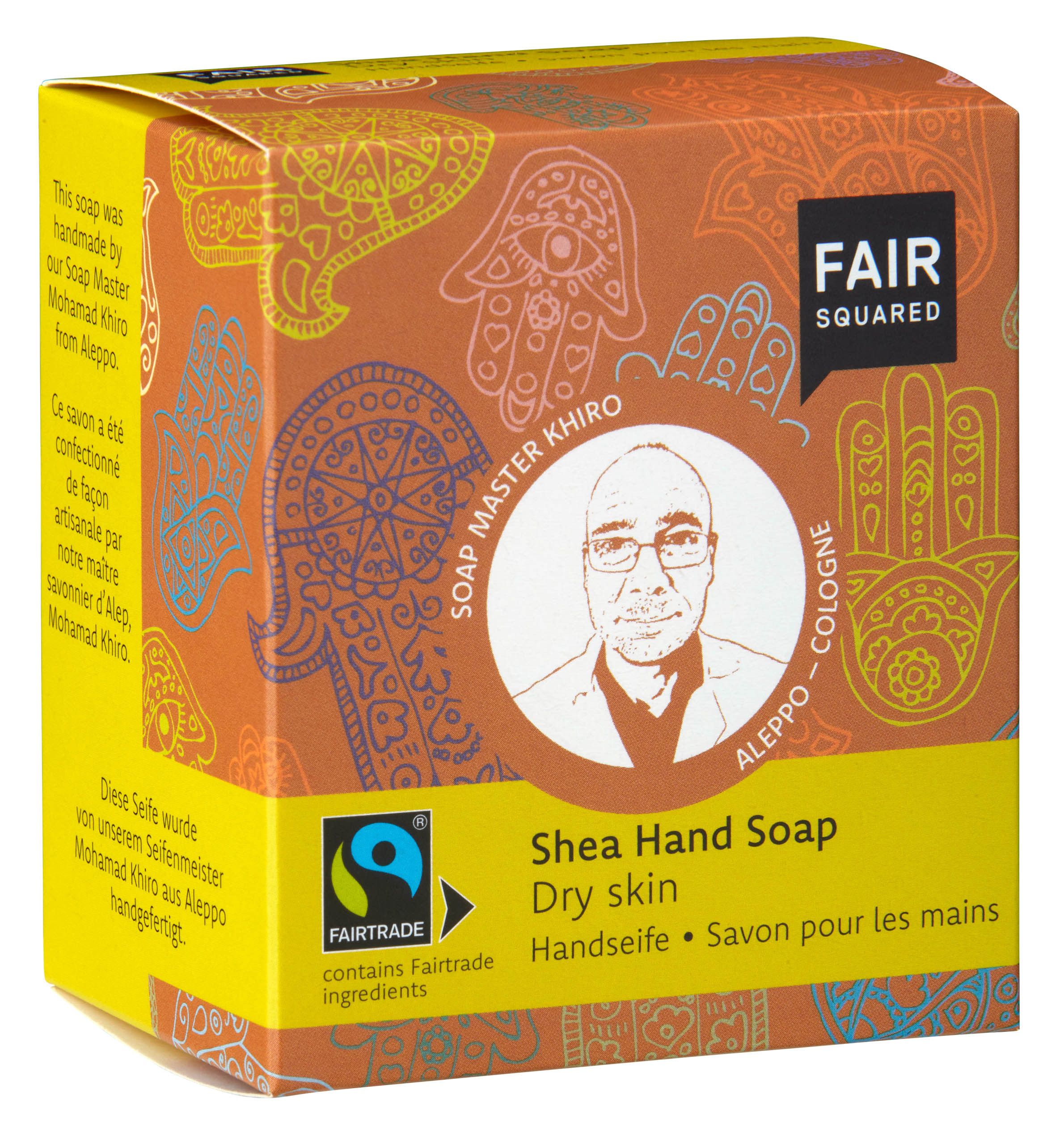Verpackung FAIR SQUARED Handseife Shea. Orangefarbener Karton mit Logo, Aufdrucken und Fairtrade-Siegel.
