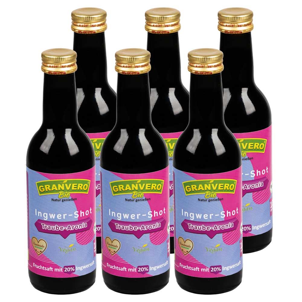 Sechs Flaschen GRANVERO Bio Ingwer-Shot Traube-Aronia. Dunkle Glasflaschen mit goldenen Verschlüssen und Etiketten.