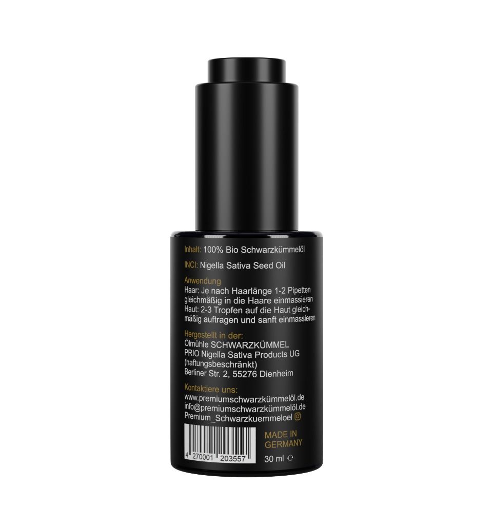 Rückseite der schwarzen Flasche. Text: 100% Bio Schwarzkümmelöl. Anwendungshinweise. Hergestellt in Deutschland. 30 ml.