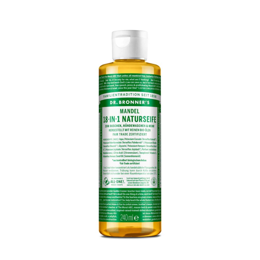 Eine Flasche Dr. Bronner's 18-in-1 Naturseife Mandel. Grün-weißes Etikett mit Produktinformationen. Weißer Verschluss. Flüssigkeit gelblich.