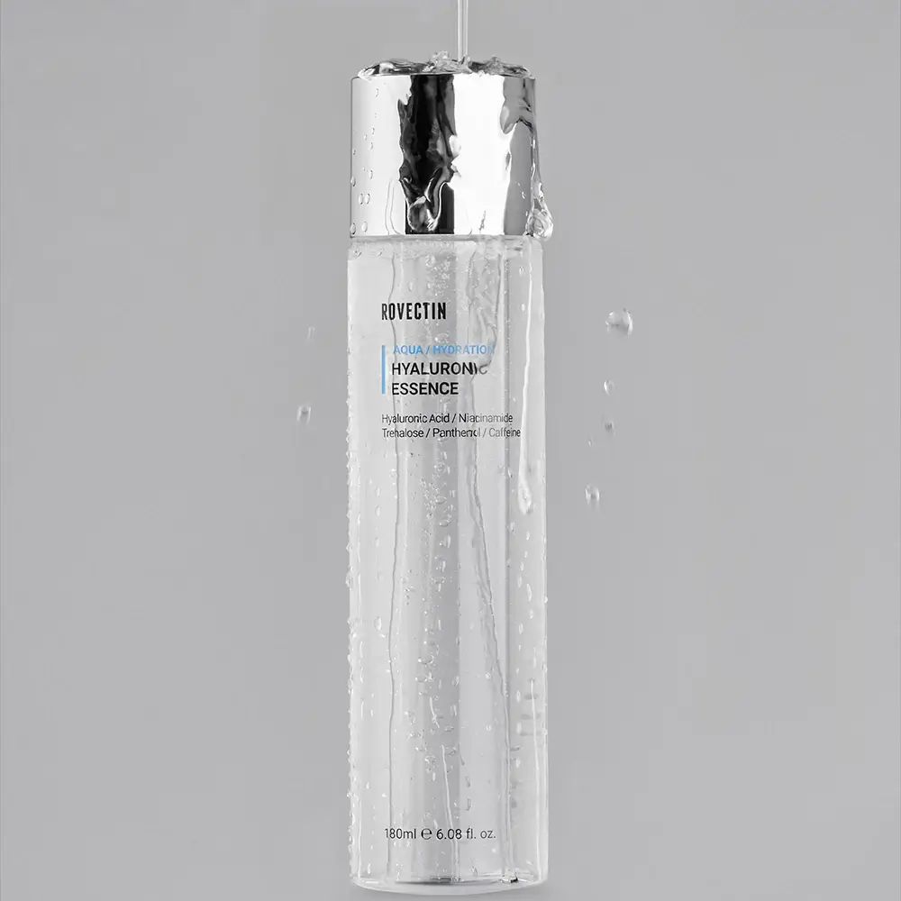 ROVECTIN Aqua/Hydration Hyaluronic Essence. Flasche mit Wasser bedeckt. Silberner Deckel.