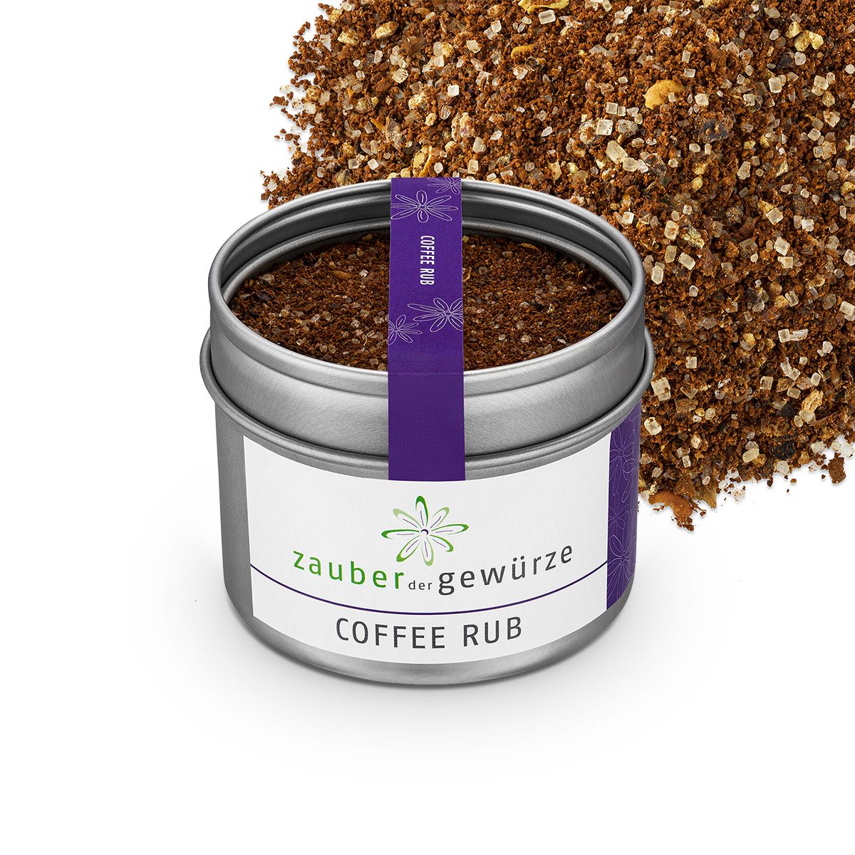 Geöffnete Dose "Zauber der Gewürze Coffee Rub". Violettes Band mit Schriftzug. Brauner Rub daneben.