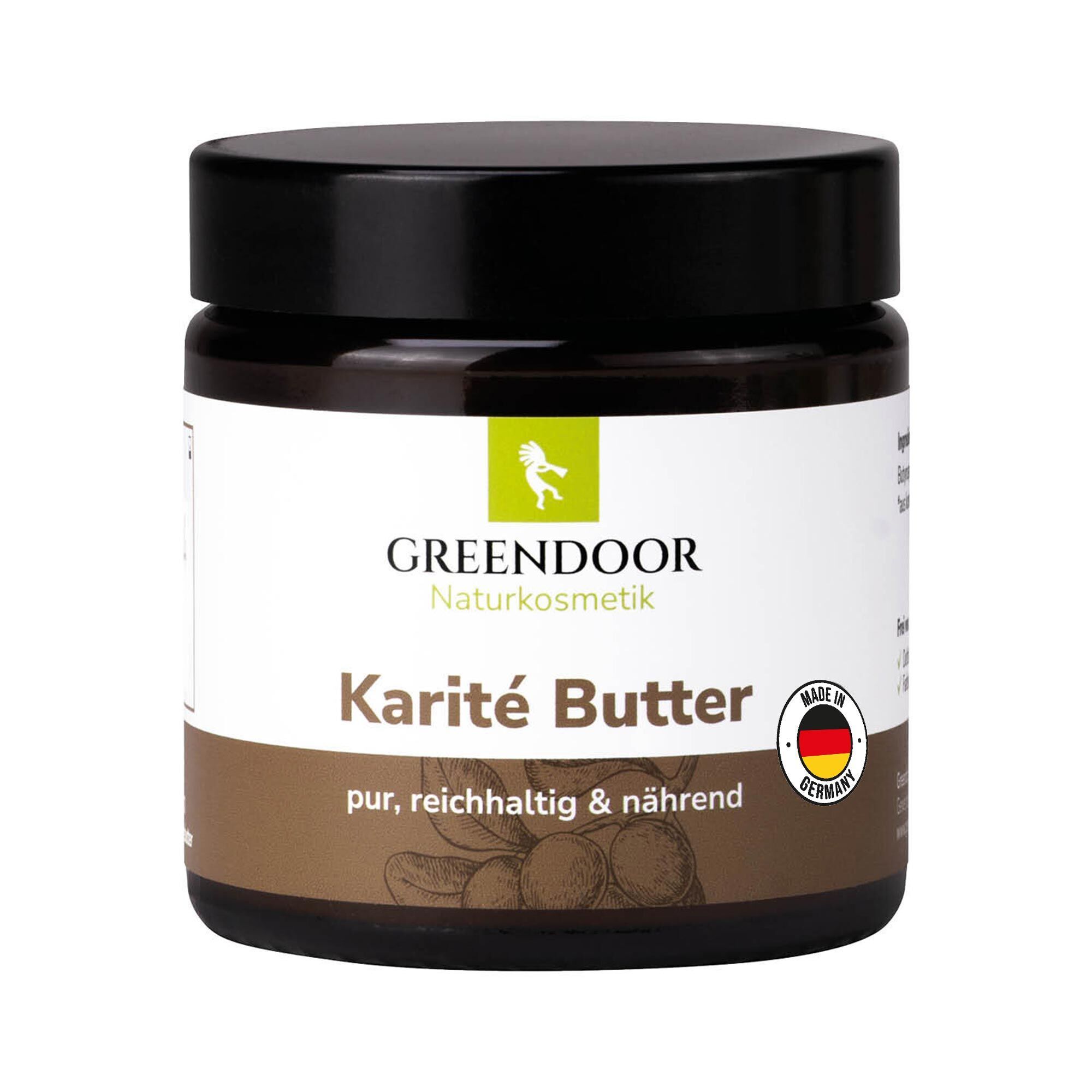 GREENDOOR Karité Butter in einem dunklen Glasbehälter mit schwarzem Deckel. Etikett mit Produktnamen und "Made in Germany"-Siegel.