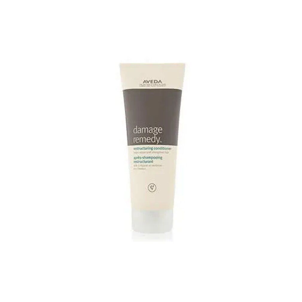Creme-Tube mit Produktnamen und Markennamen. Text: Damage Remedy, Restructuring Conditioner. 200 ml.