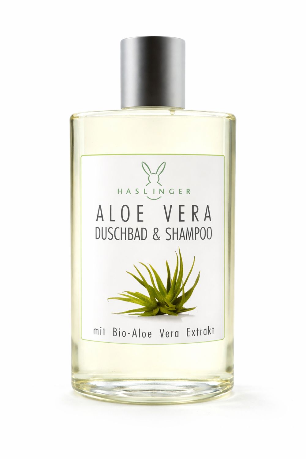 Klare Flasche mit silbernem Deckel. Etikett mit "HASLINGER", "ALOE VERA DUSCHBAD & SHAMPOO" und Aloe-Vera-Illustration.