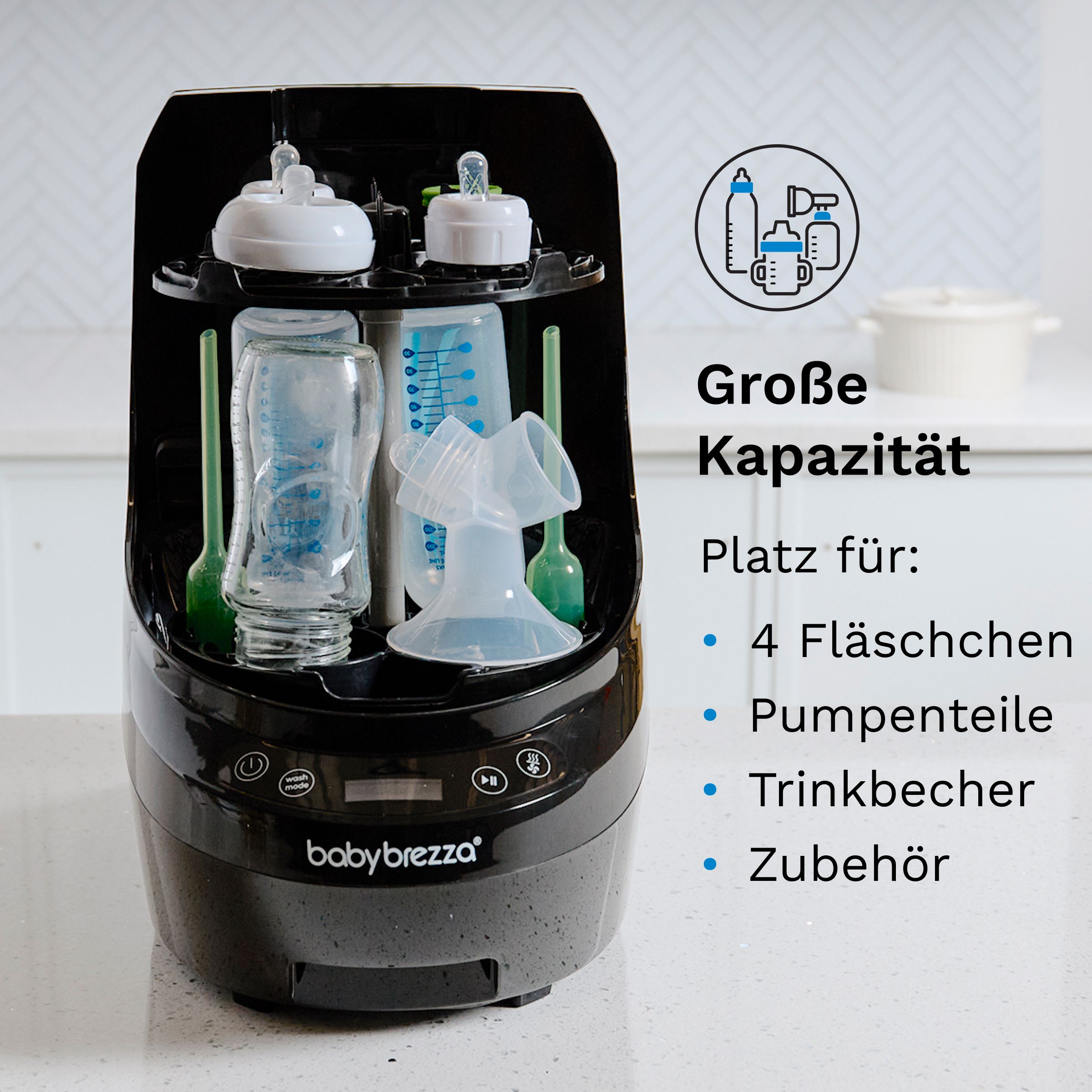 Baby Brezza Bottle Washer Pro. Schwarzes Gerät mit Flaschen, Pumpenteilen, Bechern und Zubehör. Text: Große Kapazität.