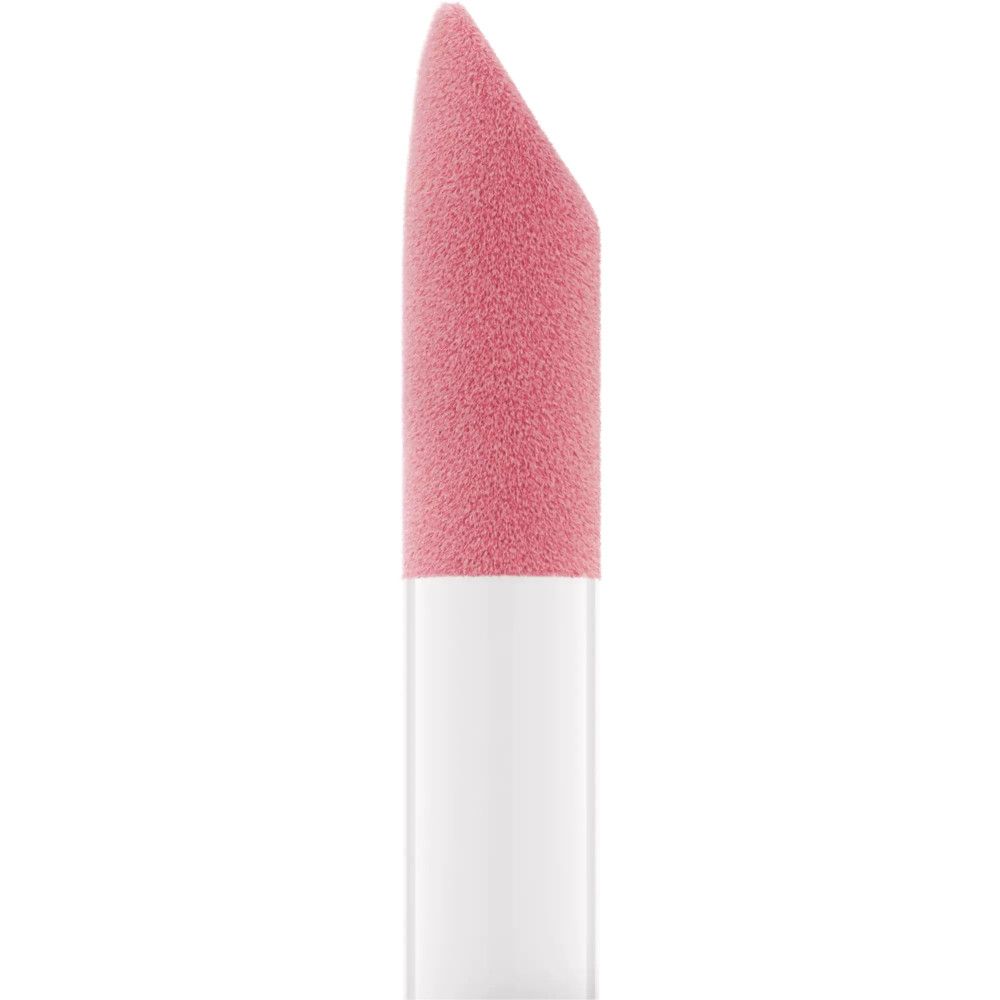 Nahaufnahme des Applikators für getöntes Lippenöl. Weißer Griff, rosa Applikatorspitze.