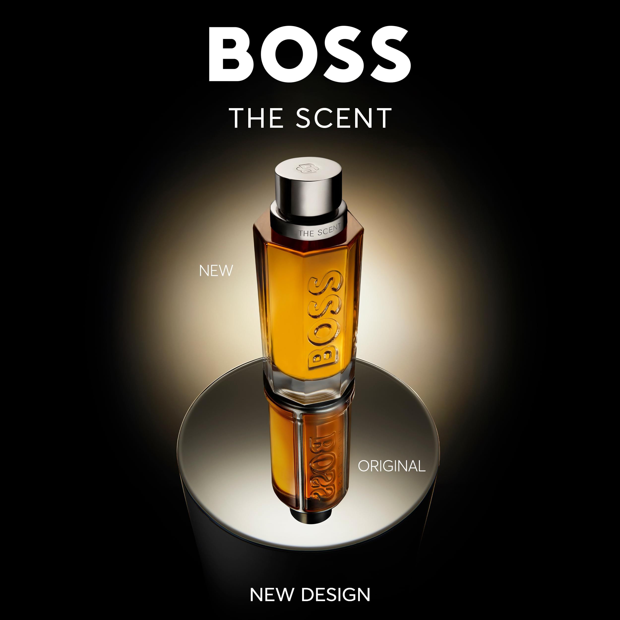 Hugo Boss The Scent Eau de Parfum Flakon auf spiegelnder Oberfläche, beleuchtet.