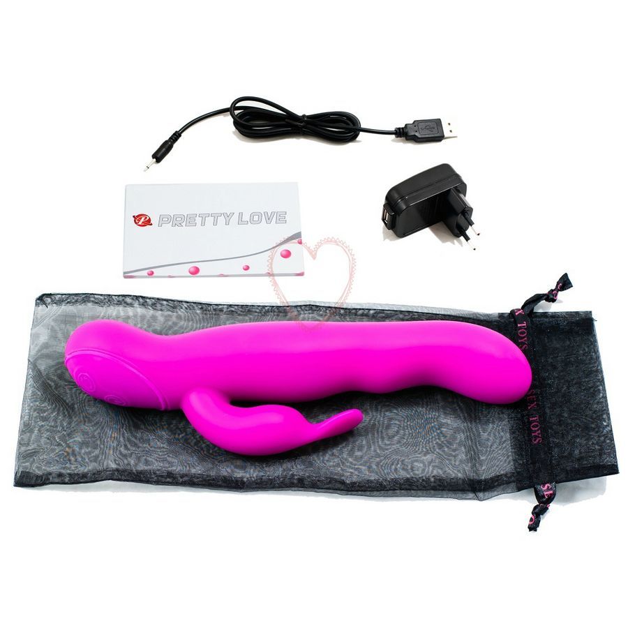 Lila Vibrator mit gebogener Form und einem zusätzlichen Element. Zubehör: Ladekabel, Netzteil, Beutel.
