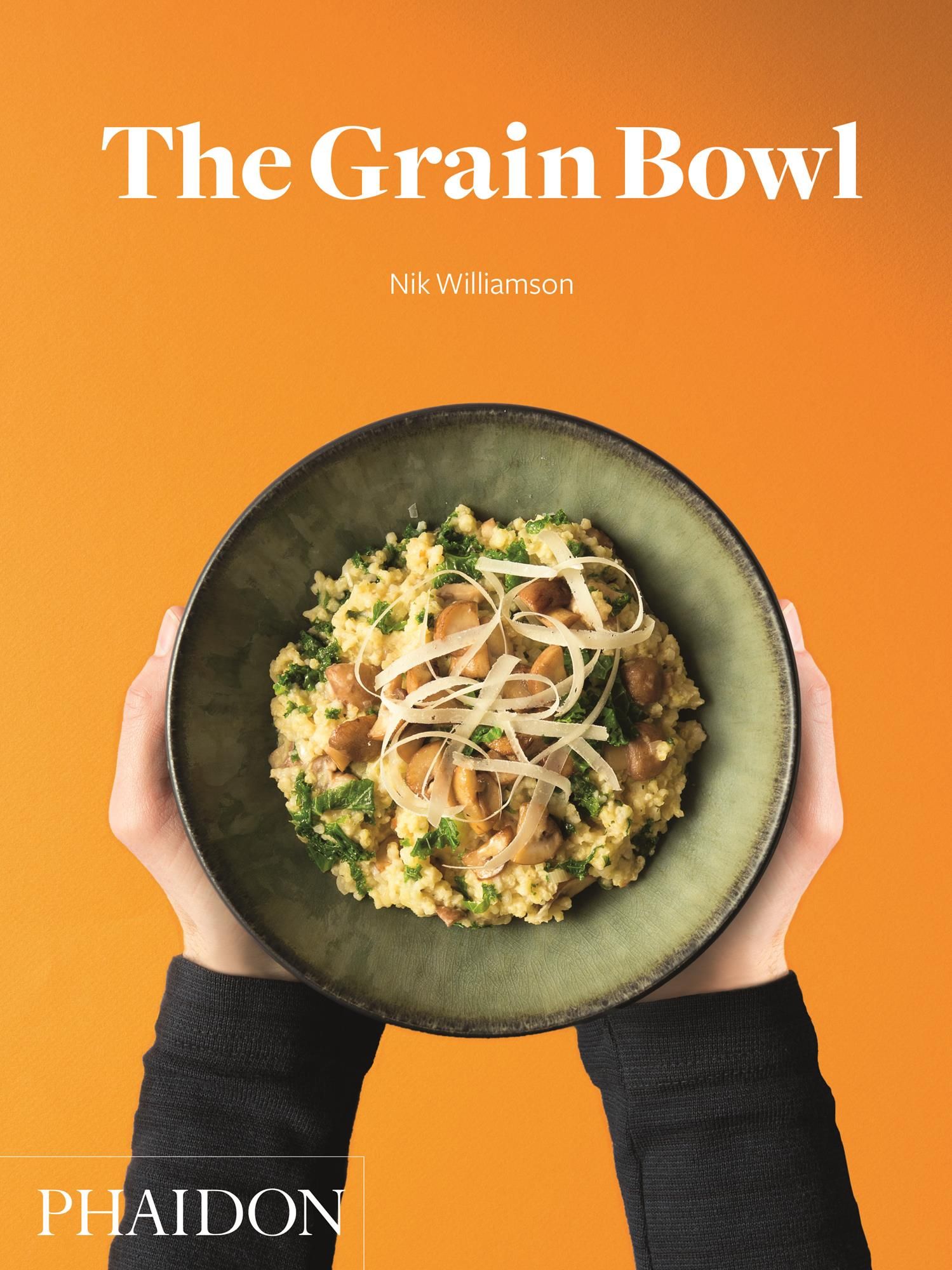 Buchcover: "The Grain Bowl" von Nik Williamson. Auf orangefarbenem Hintergrund. Eine Schüssel mit Essen wird von Händen gehalten. Logo: Phaidon.