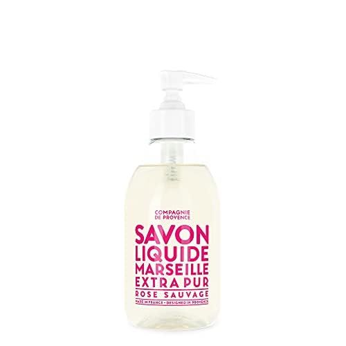 Flüssigseife mit Pumpe. Aufschrift: Savon Liquide Marseille Extra Pur Rose Sauvage. Transparente Flasche mit rosa Etikett.