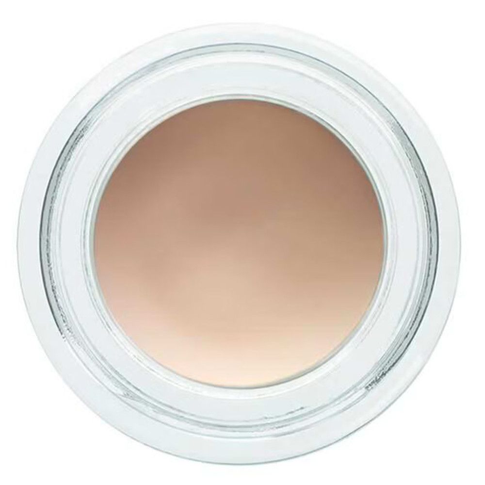 Draufsicht auf einen runden Tiegel mit beigefarbenem Inhalt. Der Tiegel ist aus transparentem Glas.