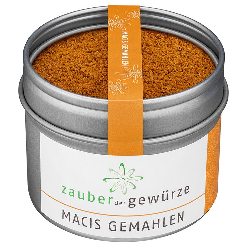 Runde Dose mit Macis gemahlen. Orangefarbenes Etikett mit Produktnamen. Silberne Dose mit weißem Etikett und grünem Logo.