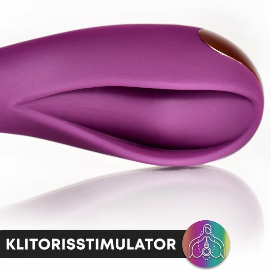 Nahaufnahme eines lila Vibrators mit goldfarbenen Akzenten. Text: Klitorisstimulator. Regenbogen-Logo.