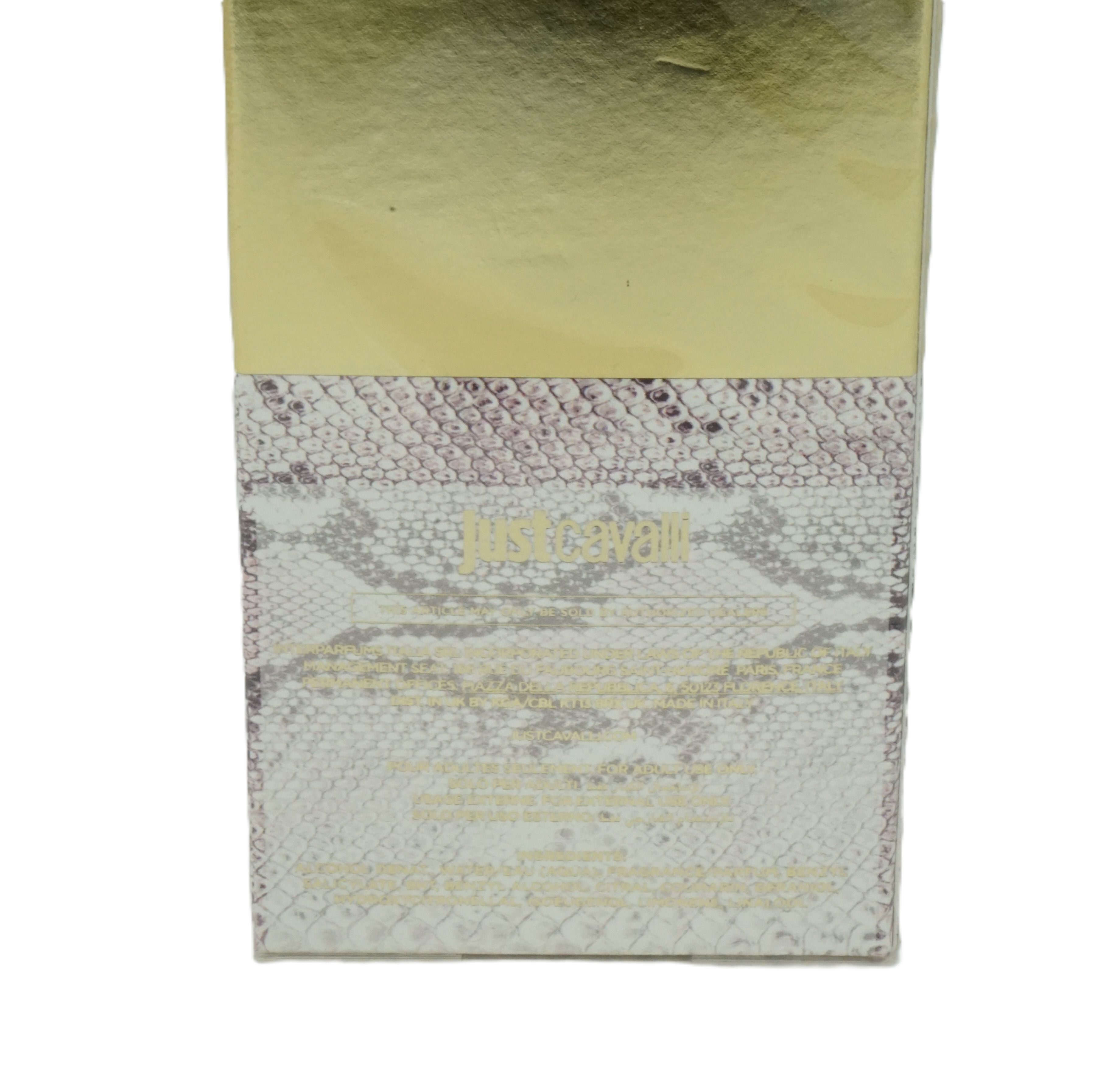 Kartonverpackung mit goldfarbenem Deckel und Schlangenmuster. Text: Just Cavalli. Rückseite mit Inhaltsangaben und Barcode.