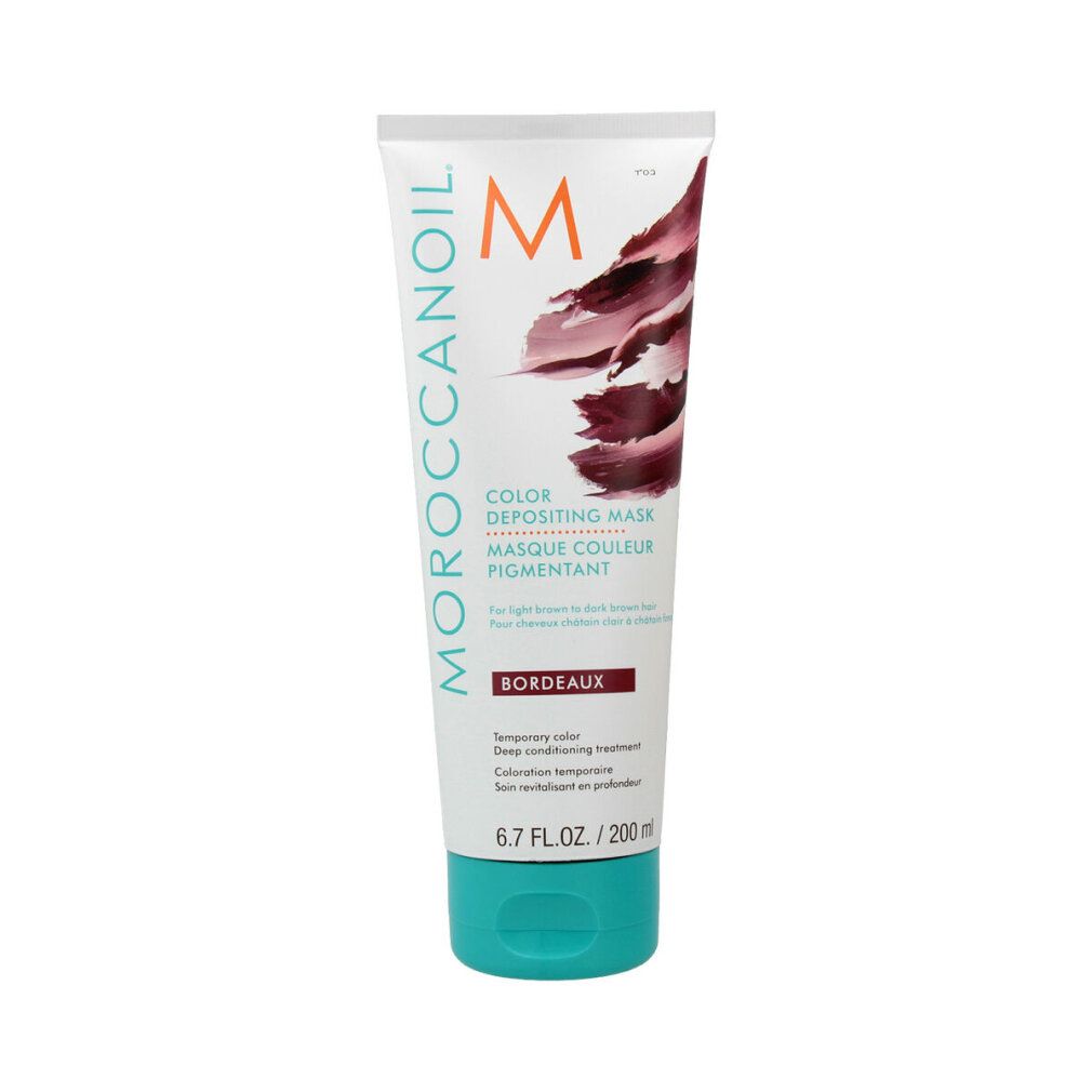 Moroccanoil Color Depositing Mask Bordeaux. Weiße Tube mit bordeauxfarbenem Farbverlauf. Türkisgrüner Deckel. Text: Color Depositing Mask.