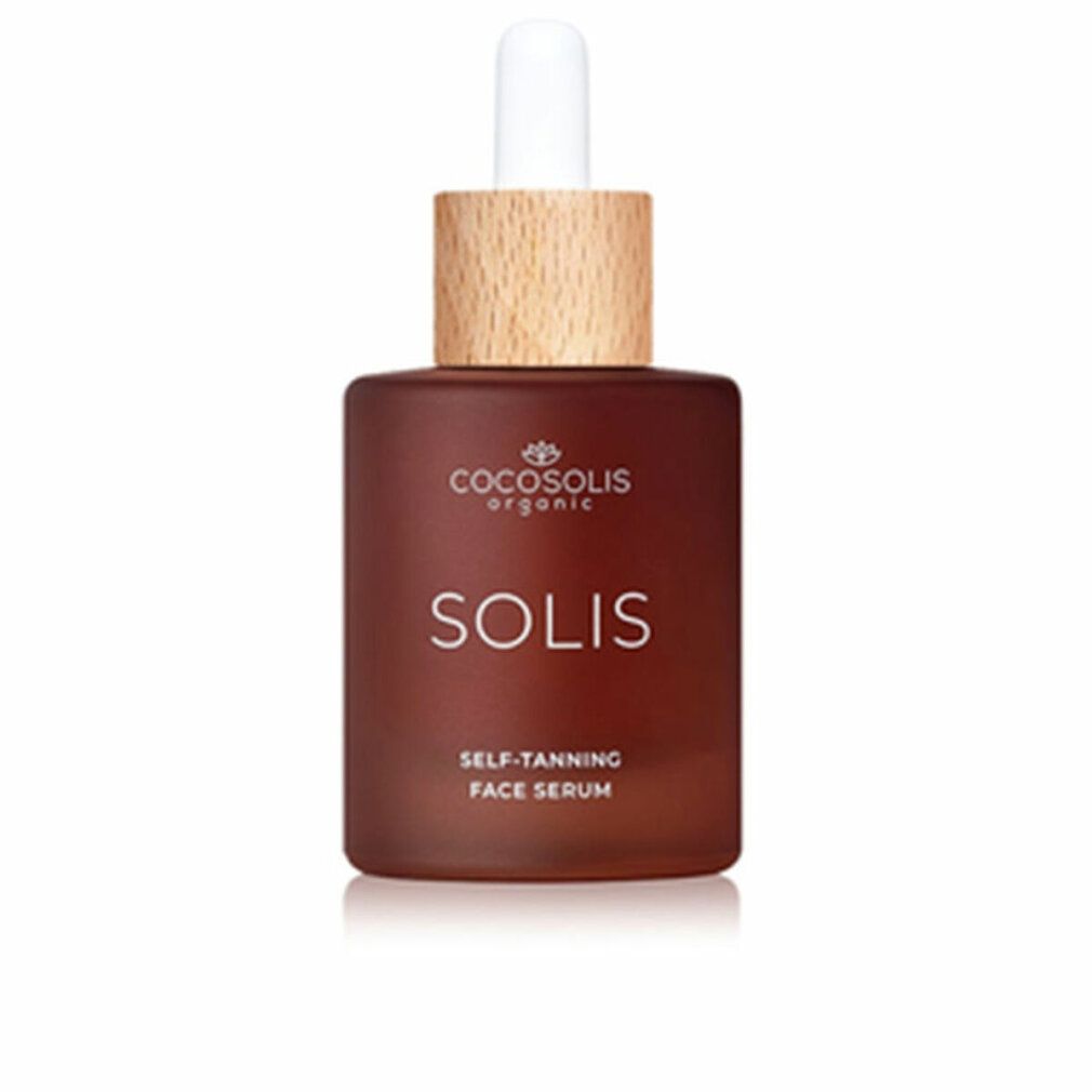 Braune Glasflasche mit Pipette, Holzdeckel. Beschriftung: COCOSOLIS ORGANIC SOLIS SELF-TANNING FACE SERUM.