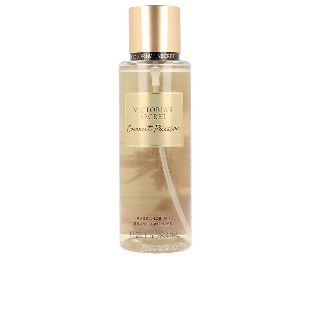 Victoria's Secret Körpernebel 'Coconut Passion' in klarer Flasche mit goldenem Verschluss. Duftnoten: Kokosmilch, warmer Sand.