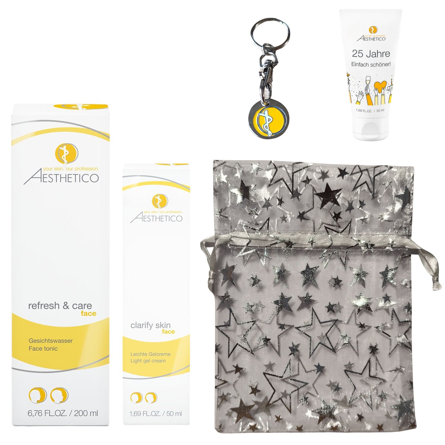 Das Aesthetico Weihnachtsset enthält: Refresh & Care Gesichtswasser (200 ml), Clarify Skin Light Gel Cream (50 ml), eine kleine Tube mit der Aufschrift "25 Jahre Einfach schöner", einen Schlüsselanhänger und eine silberne Sternen-Geschenktasche.