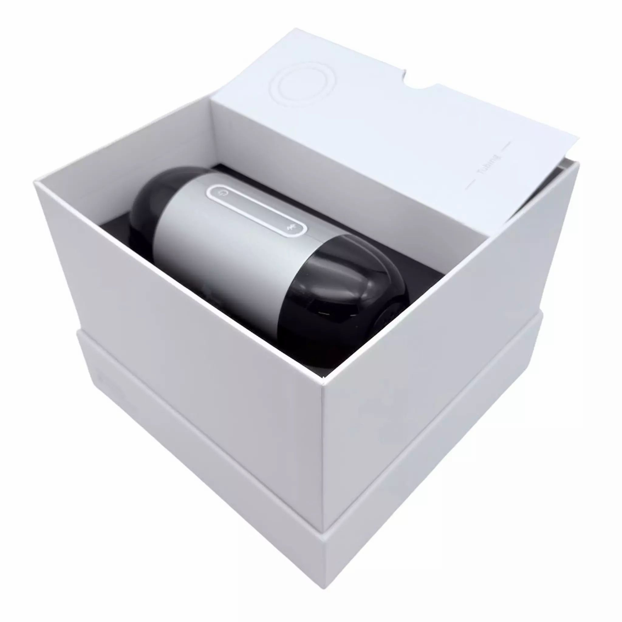 APAP-Gerät in weißer Verpackung. Gerät schwarz-silber, zylindrisch. Deckel geöffnet.