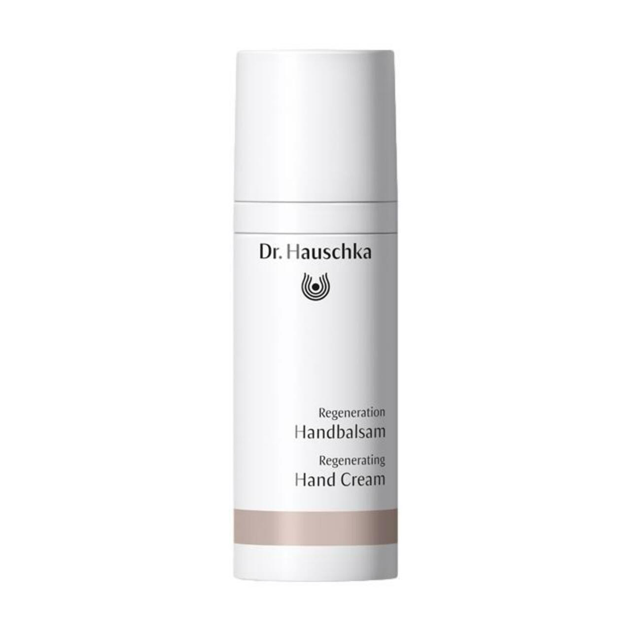Weiße Tube mit Deckel. Aufschrift: Dr. Hauschka, Regeneration Handbalsam, Regenerating Hand Cream. Brauner Streifen.