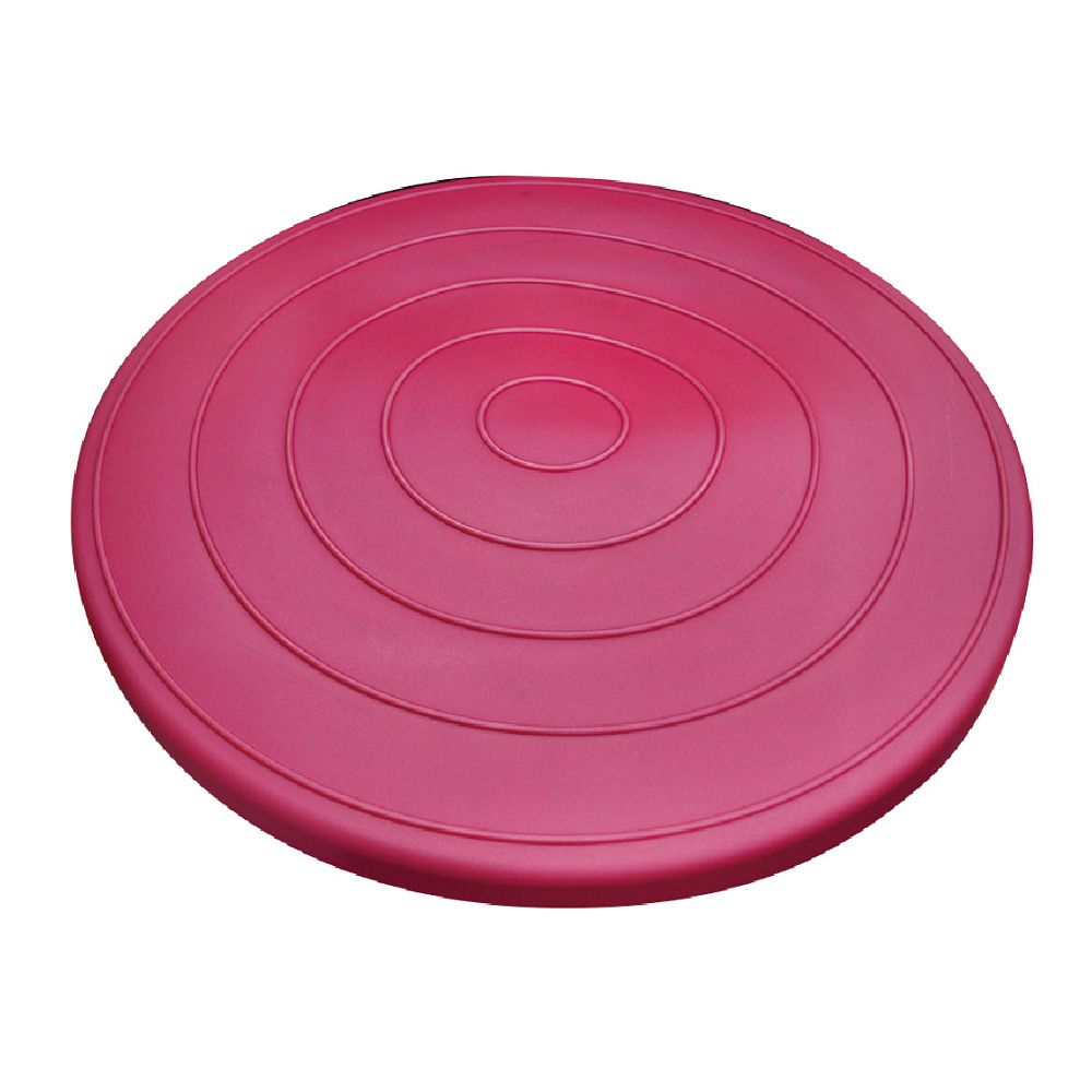 Runde, magentafarbene Balance-Disc mit konzentrischen Rillen. Oberseite mit erhabenen Kreisen, flache Unterseite.