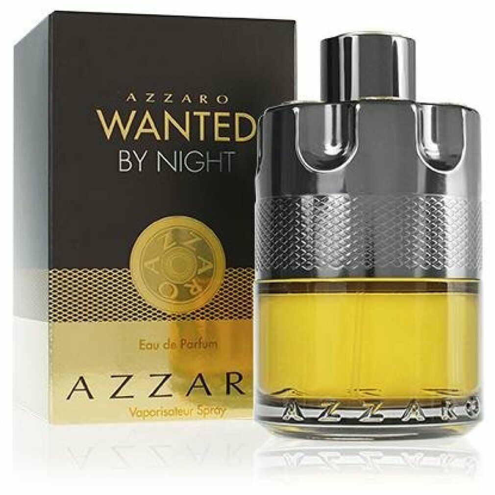 Azzaro Wanted by Night Eau de Parfum. Flakon mit goldgelber Flüssigkeit, neben schwarzer Verpackung mit goldener Schrift.