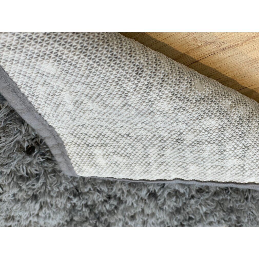 Rückseite der grauen Royal Dry Fußmatte. Rutschfeste Unterseite mit weißem, geometrischem Muster.