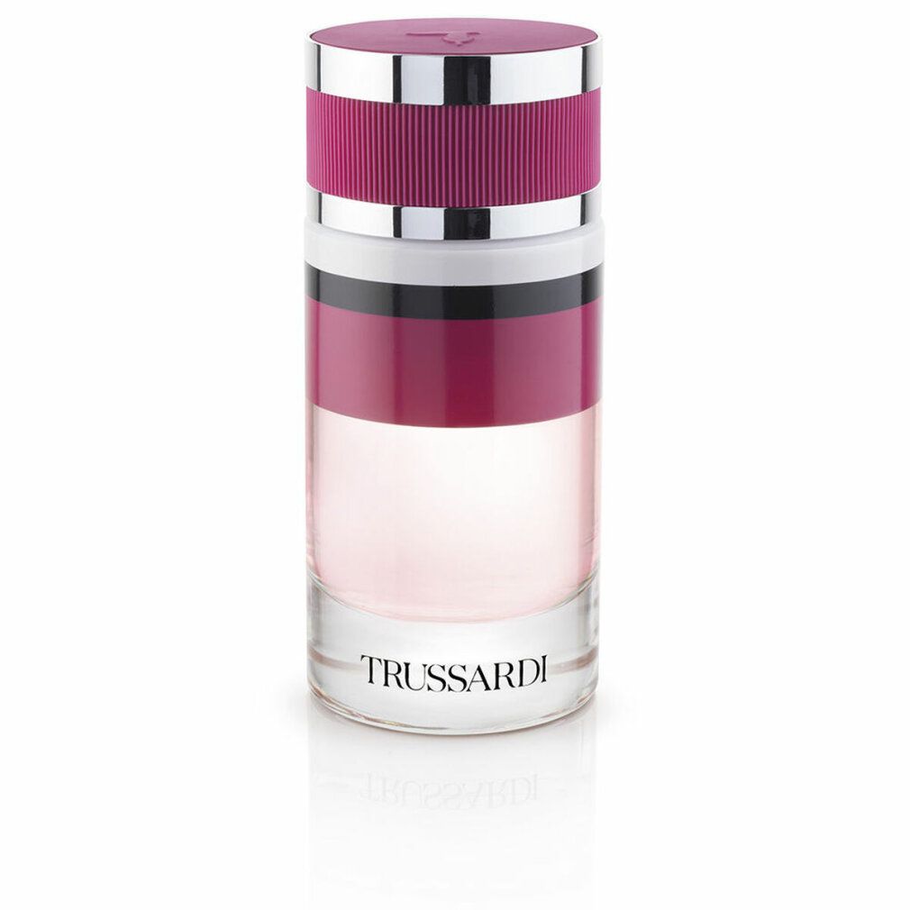 Zylindrische Flasche. Rosa Flüssigkeit, rosa Deckel, silberne Akzente. Text: TRUSSARDI.