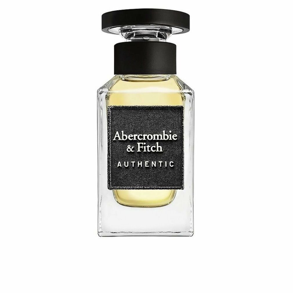 Quadratischer Glasflakon mit schwarzem Verschluss. Schwarzes Etikett mit Aufschrift: Abercrombie & Fitch AUTHENTIC.