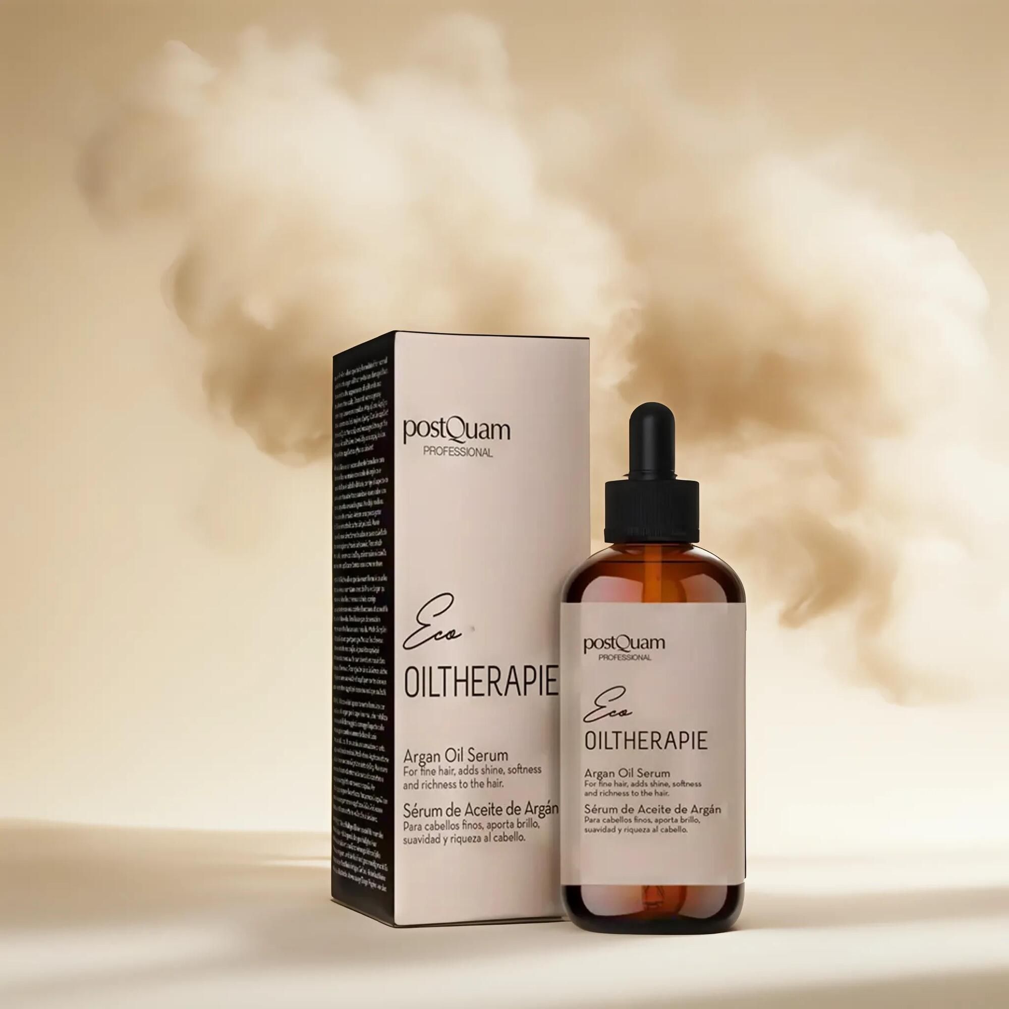 Braune Glasflasche mit Tropfer und Verpackung. Aufschrift: Eco Oiltherapie, Arganöl-Serum. Marke: postQuam. Hintergrund: Rauch.