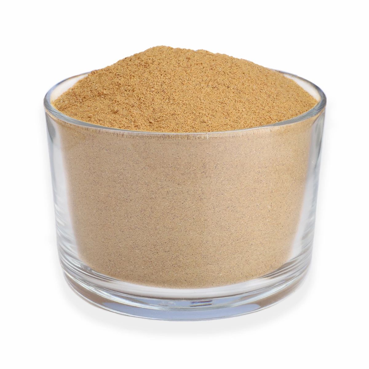 Glas mit braunem Pulver gefüllt. Klare Glaswandung, Pulverstruktur sichtbar.