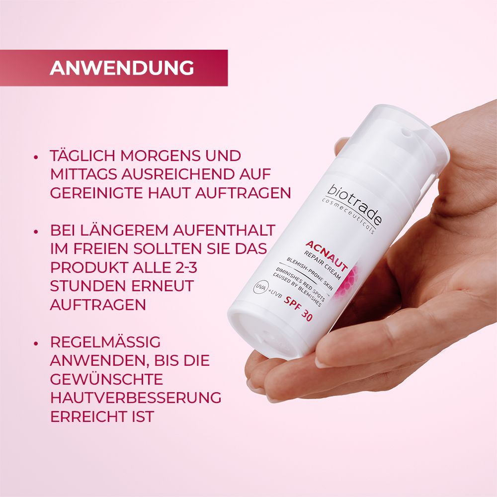 Produkt-Tube in Hand. Text: Biotrade, Acnaut Repair Cream, SPF 30. Anwendungshinweise.