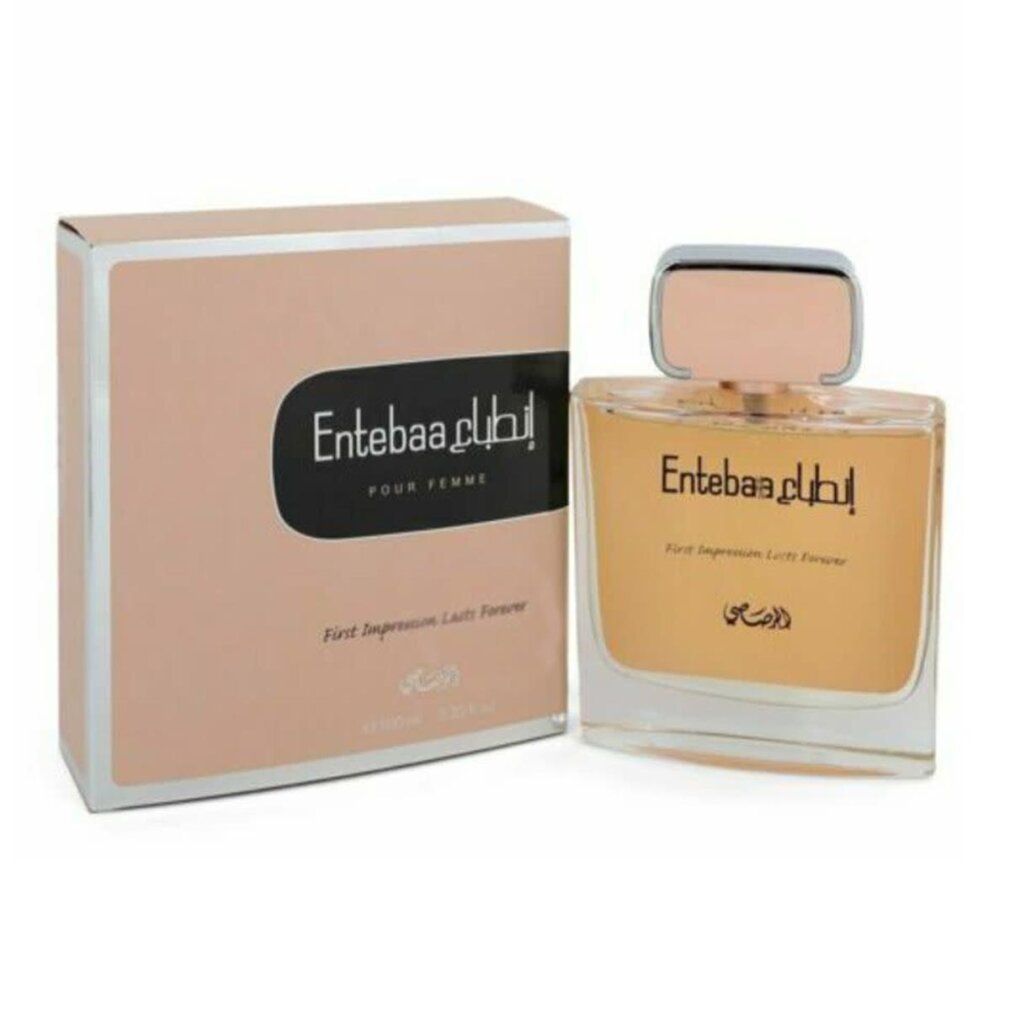 Parfümflasche und Verpackung. Flasche mit rosafarbenem Verschluss, goldfarbenem Inhalt und arabischer Schrift. Verpackung in Rosa mit schwarzem Label.