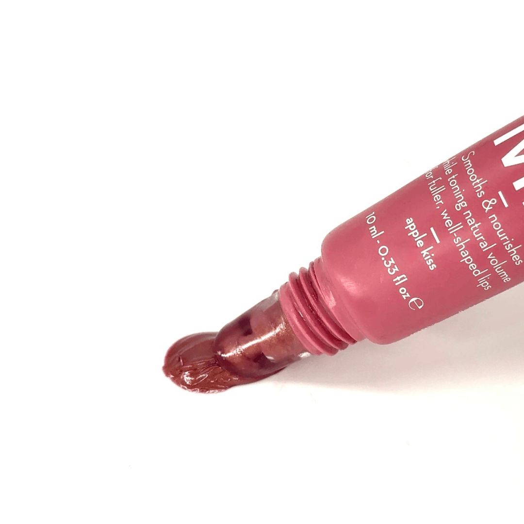 Rosa Lippenplumper-Tube, Produkt austretend. Text: "apple kiss", "10 ml - 0.33 fl oz e".