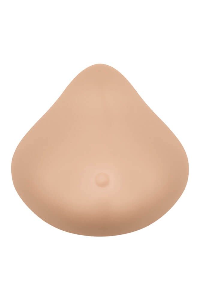 Brustprothese, elfenbeinfarben, tropfenförmig. Mit kleiner Brustwarzen-Imitation. Glatte Oberfläche.
