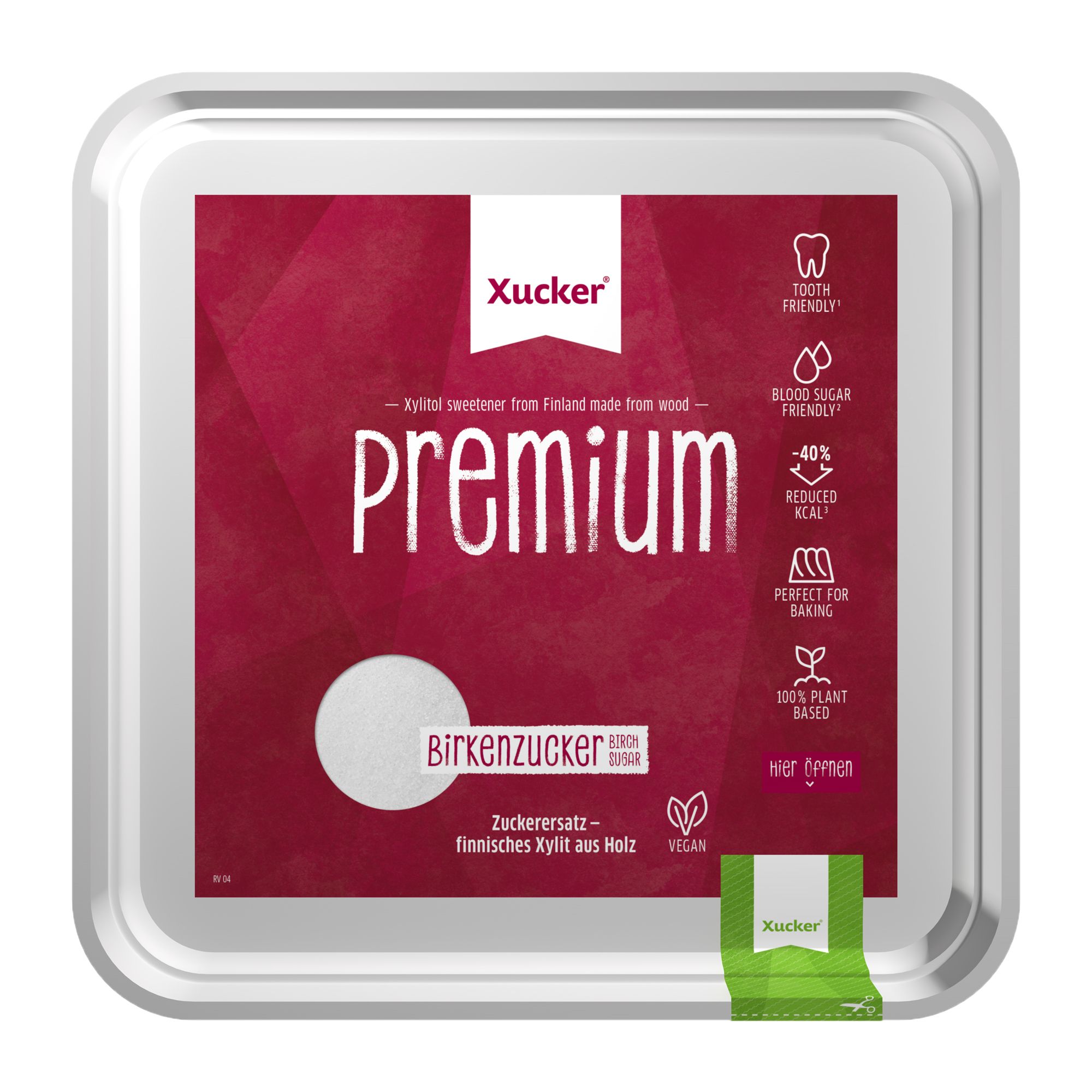 Quadratische Verpackung mit "Xucker Premium". Enthält Birkenzucker. Kleine grüne Einzelverpackung unten rechts.