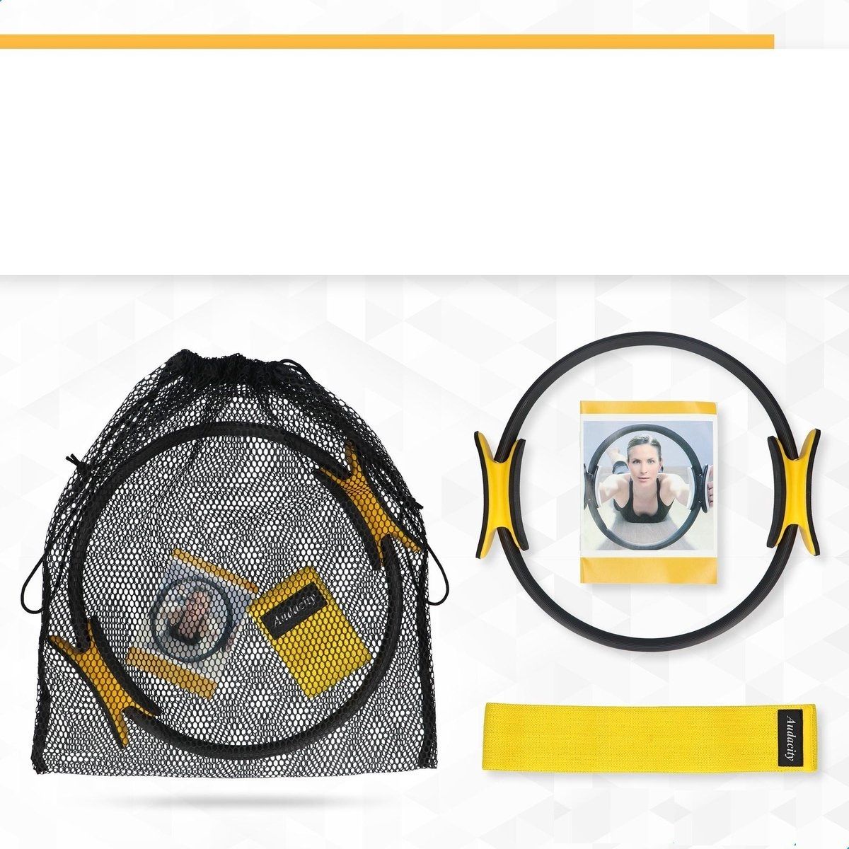 Pilates-Ring, Widerstandsband und Zubehör in schwarzer Netztasche. Ring mit gelben Griffen. Gelbes Widerstandsband.