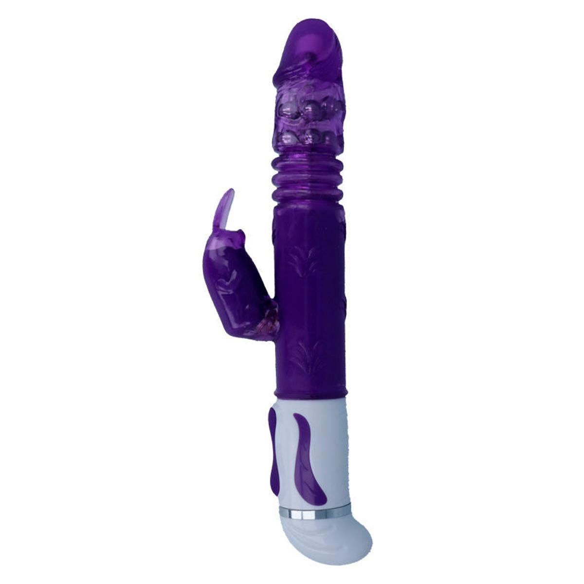 Lila Vibrator mit Hasenohren-Aufsatz. Zylindrischer Schaft, geriffelte Oberfläche. Weißer Sockel mit silbernem Ring.