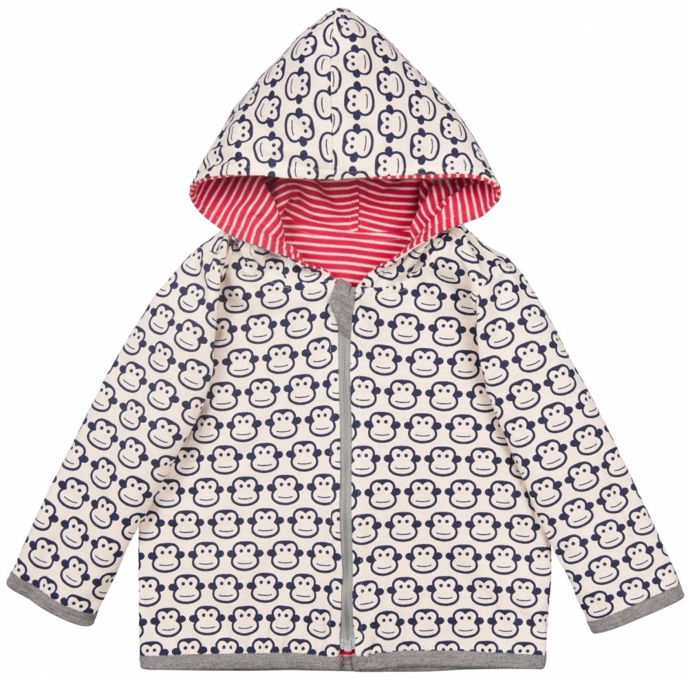 Wendejacke mit Affenmuster und Kapuze. Reißverschluss, graue Einfassungen. Innenseite rot-weiß gestreift. Affenmuster.