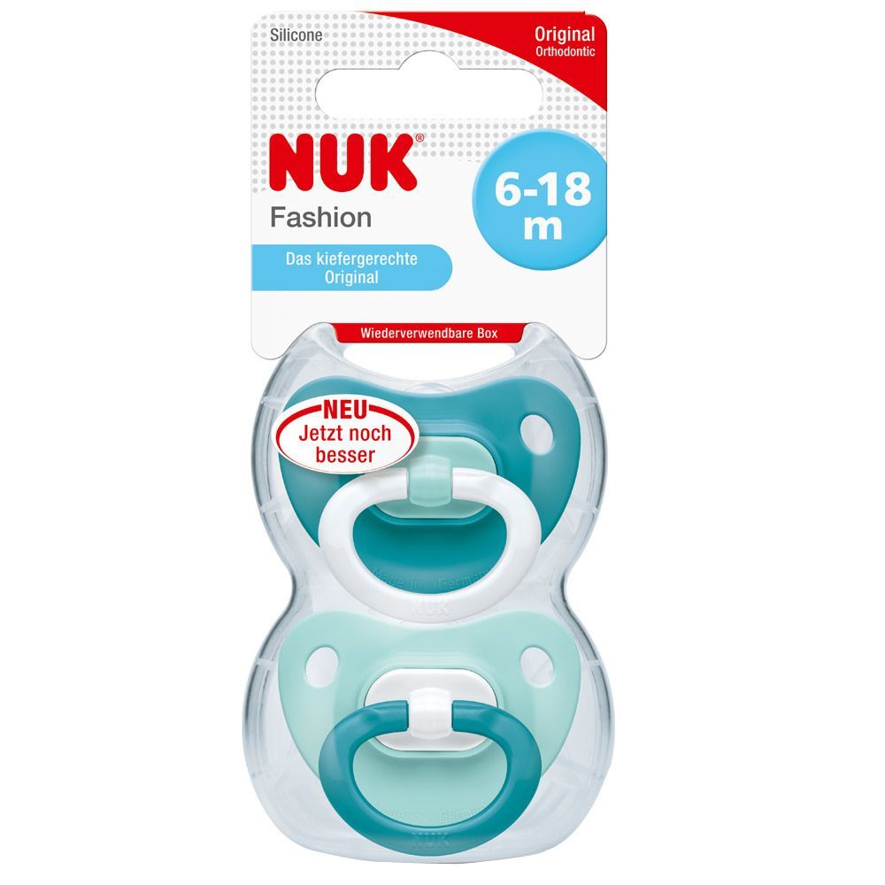 Zwei Schnuller in wiederverwendbarer Box. Türkis und weiß. Verpackung mit NUK-Logo, 6-18m. "NEU Jetzt noch besser".